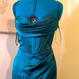 floor length dress  and has a high slit on right side it’s a size 8,